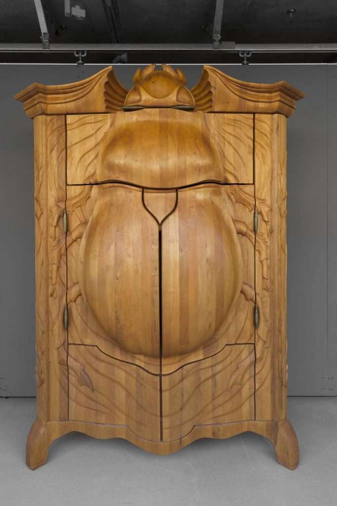 The Latvan Artist Carves A Wooden Cabinet In The Shape Of A Giant Beetle