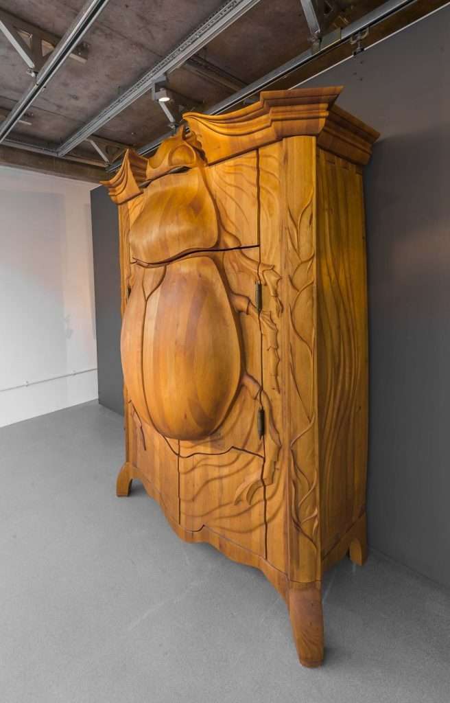 The Latvan Artist Carves A Wooden Cabinet In The Shape Of A Giant Beetle